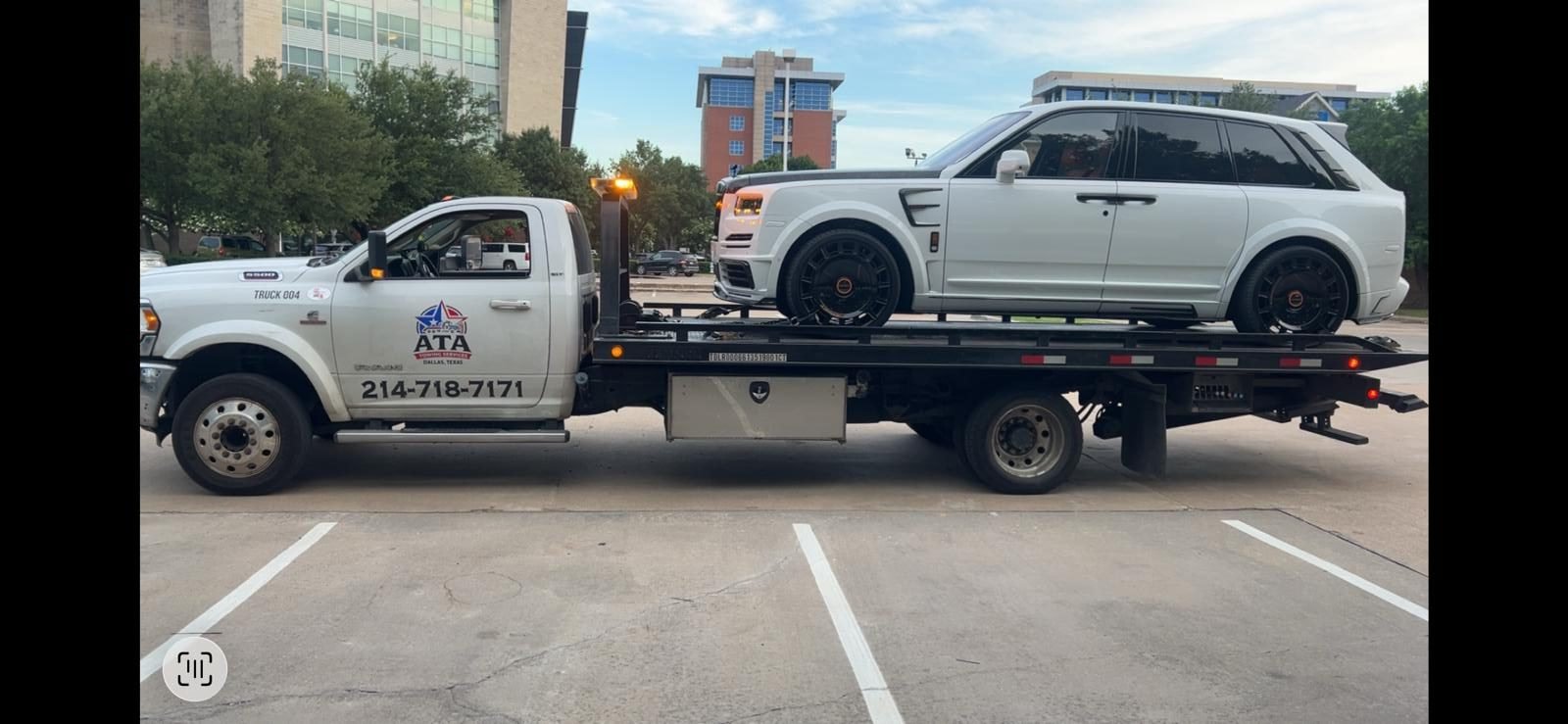 Two ATA Towing Services flatbed trucks in Dallas